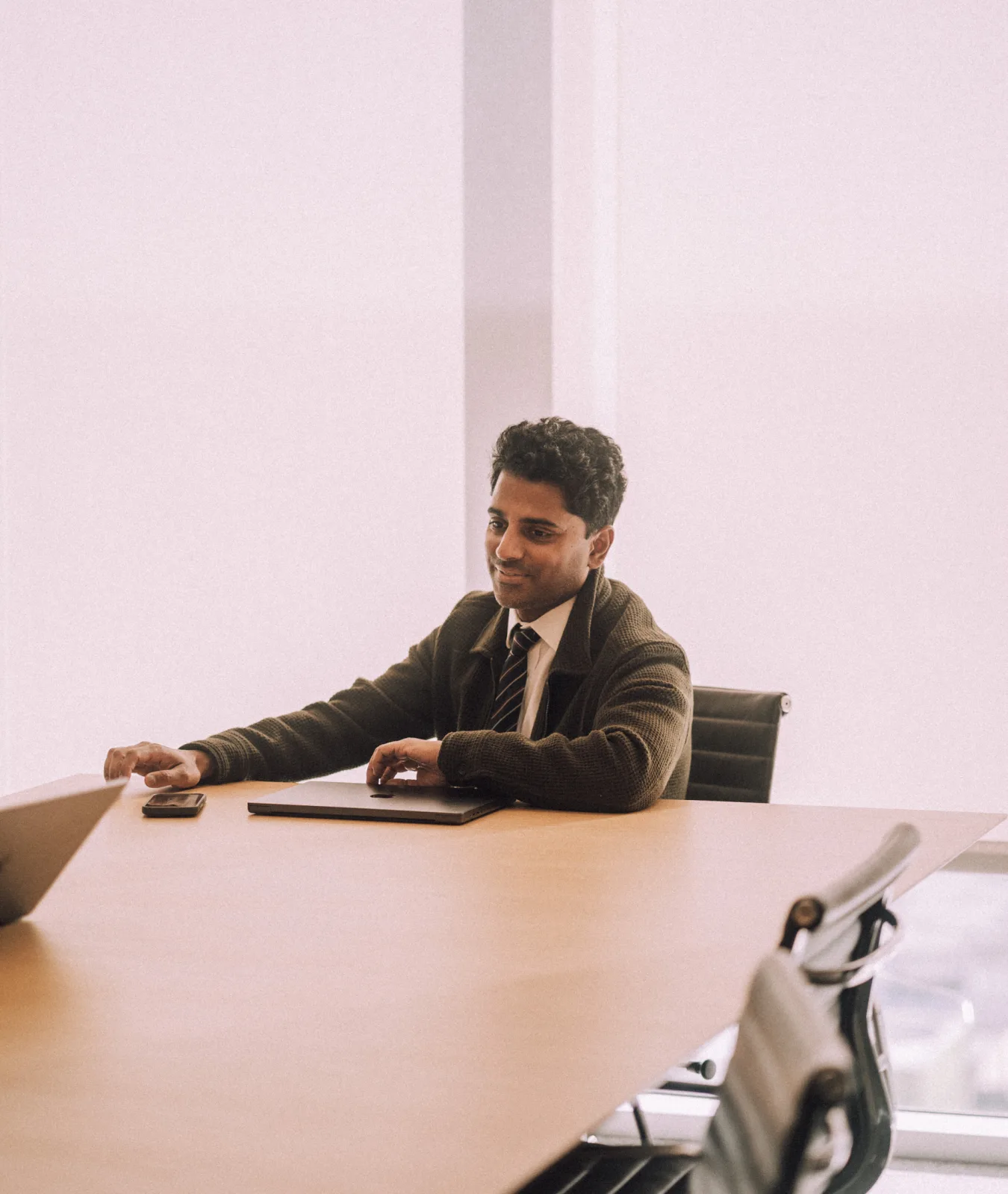 Naveen Selvadurai working at a table